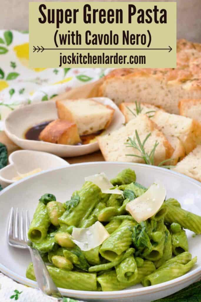 Bowl of easy green pasta and focaccia behind it.
