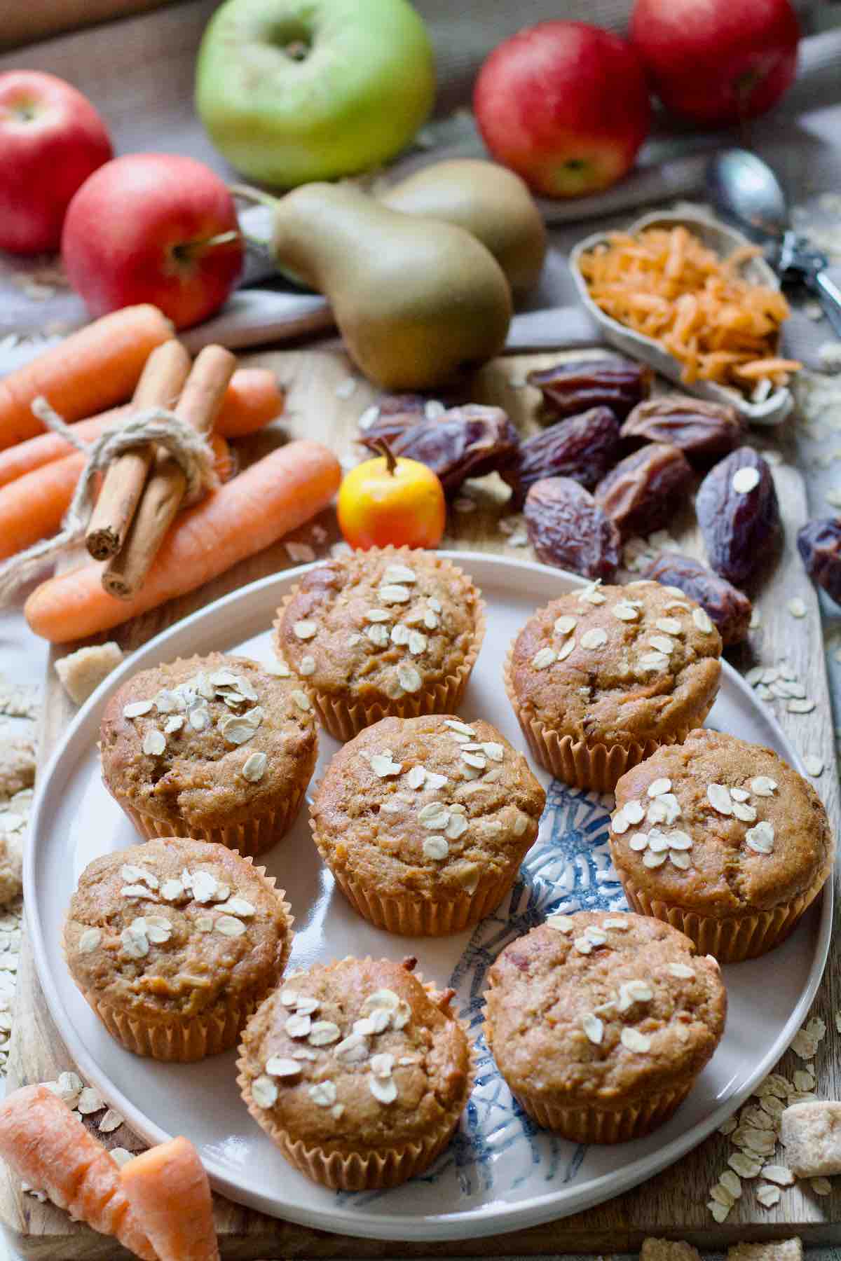 Carrot and date muffins on a round plate.