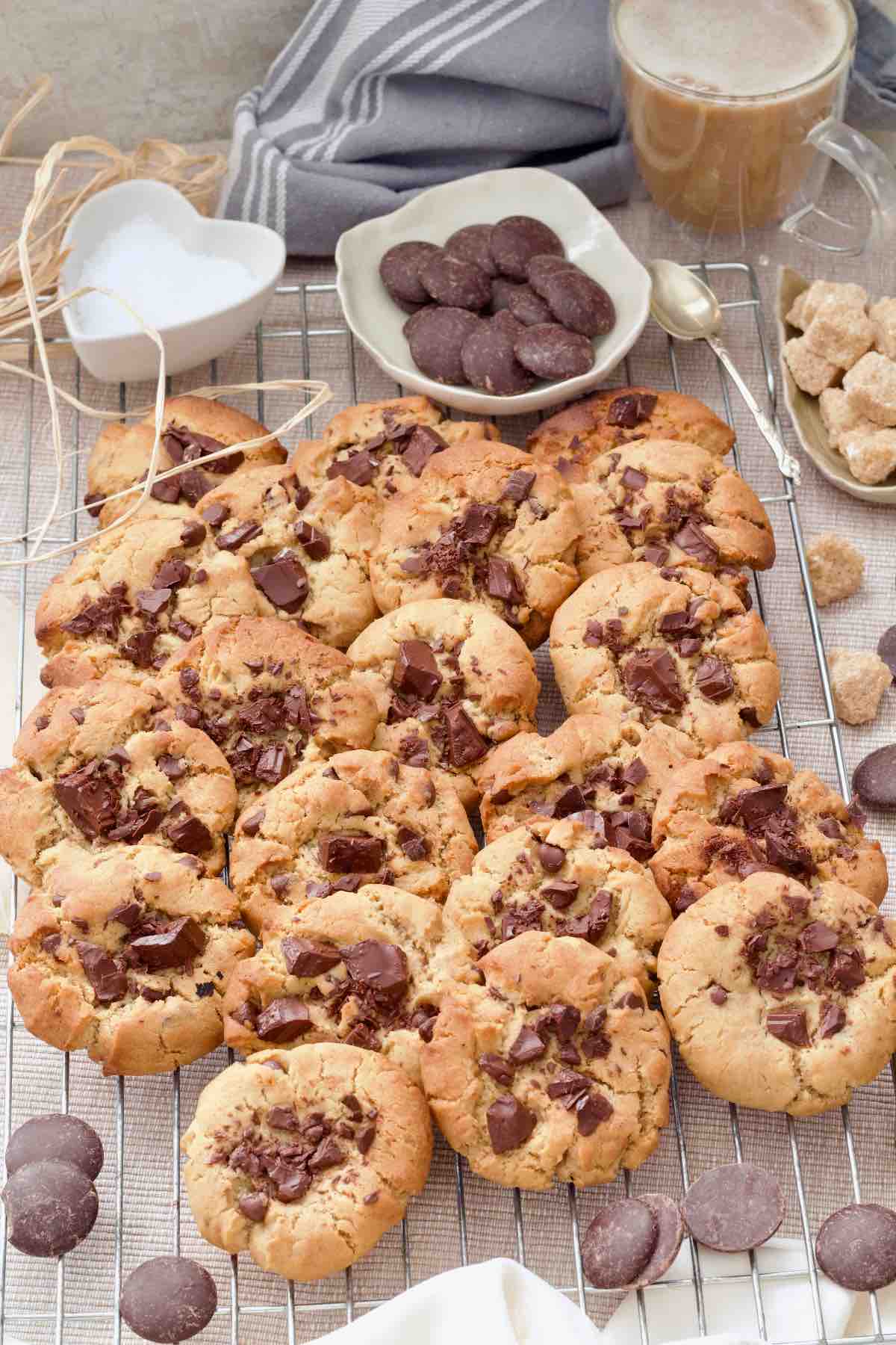 Batch of chocolate chip cookies on a cooling rack.