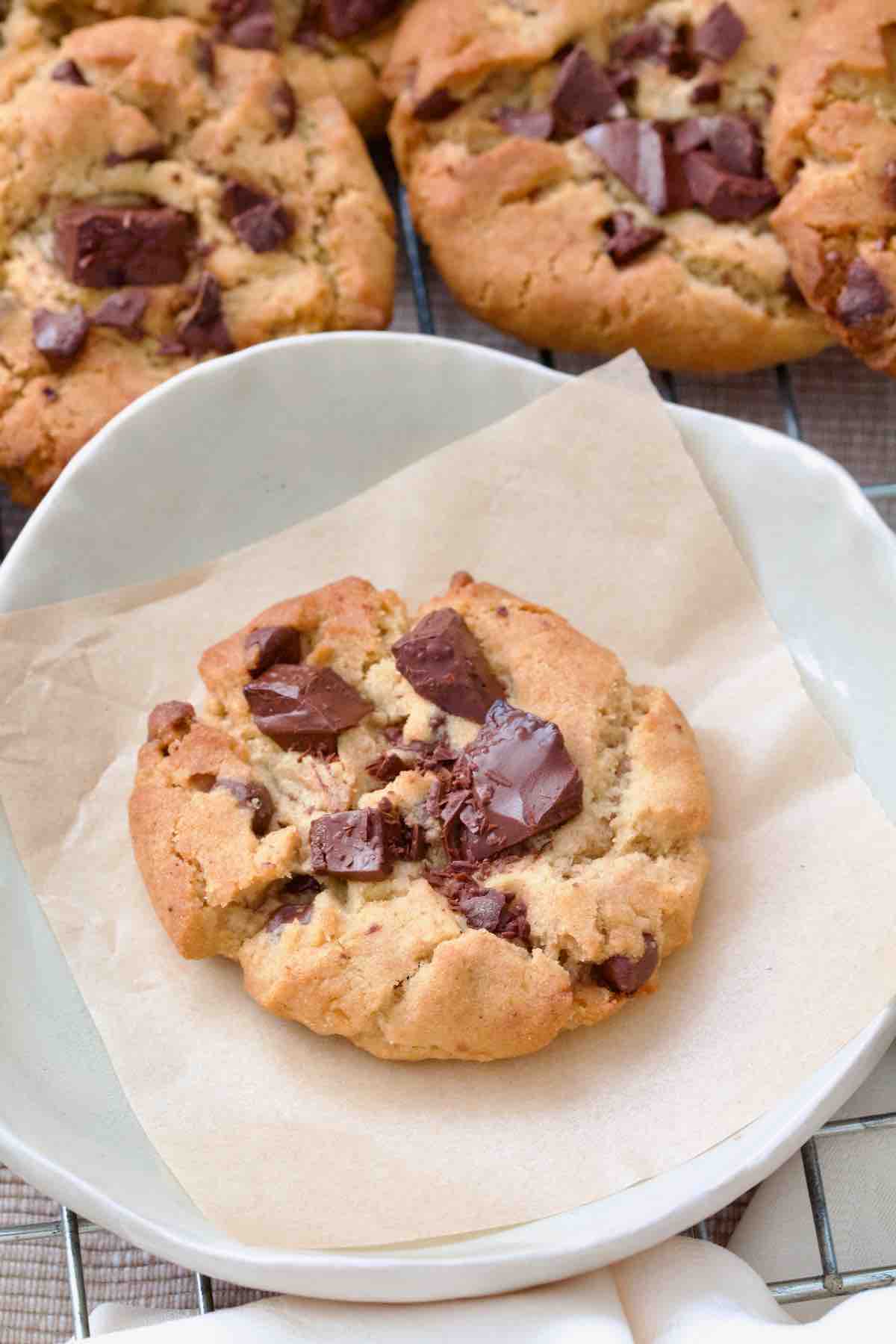 Chocolate chip cookie on a small plate.